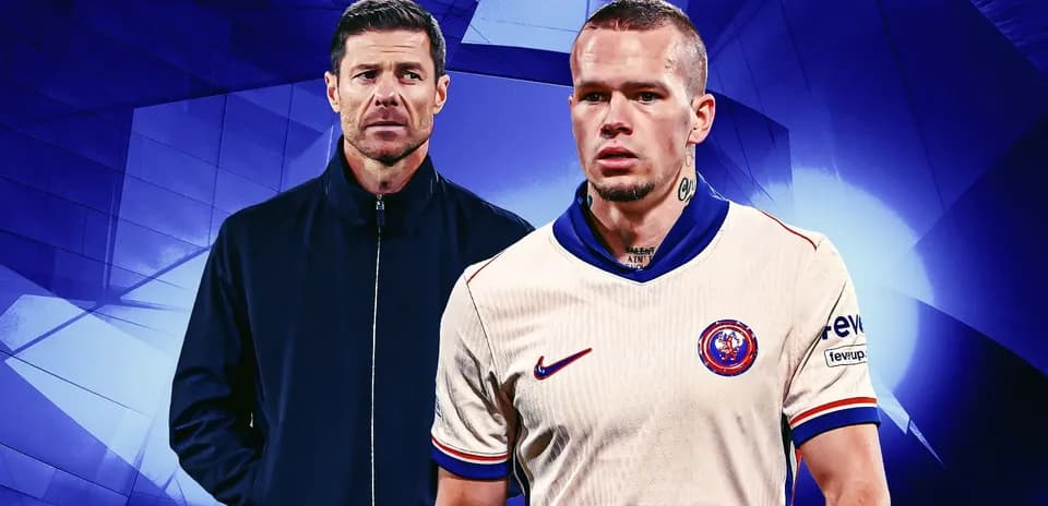 Futbolchilar va murabbiy fonida ko'rsatilgan