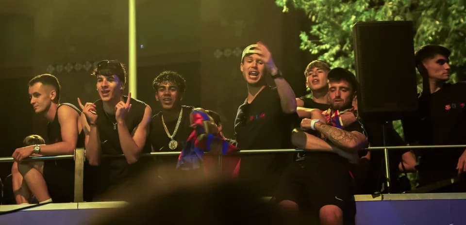 Fans celebrating on balcony during event