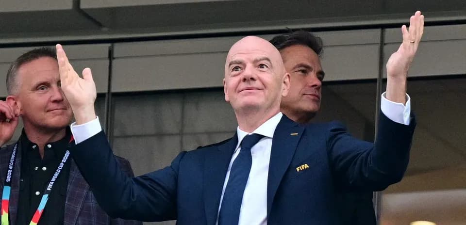 FIFA official gesturing during event from box