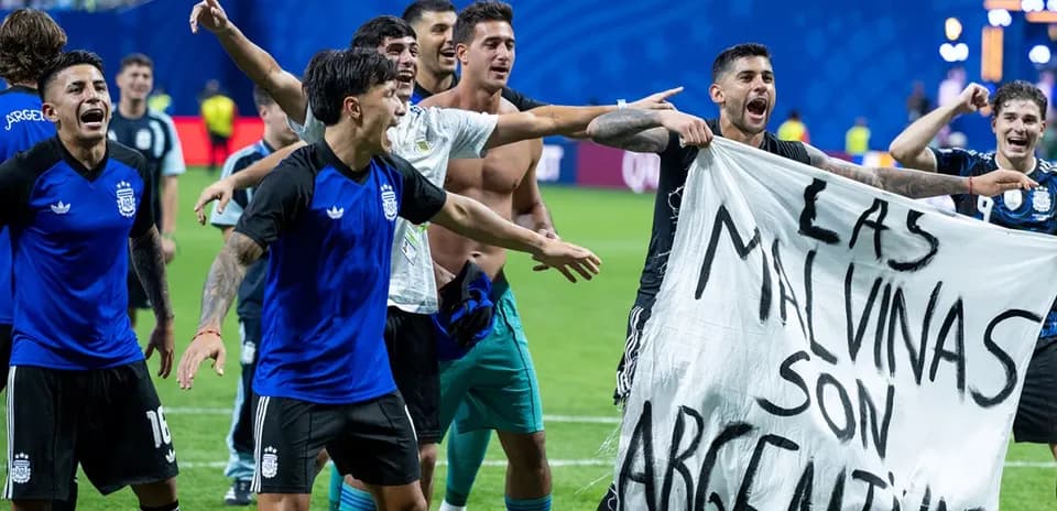 Argentinian players celebrating with a banner