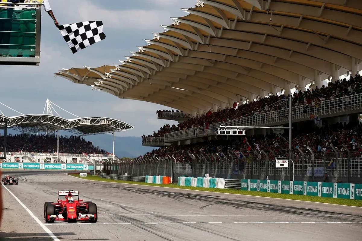 Formula 1 car crossing finish line with checkered flag