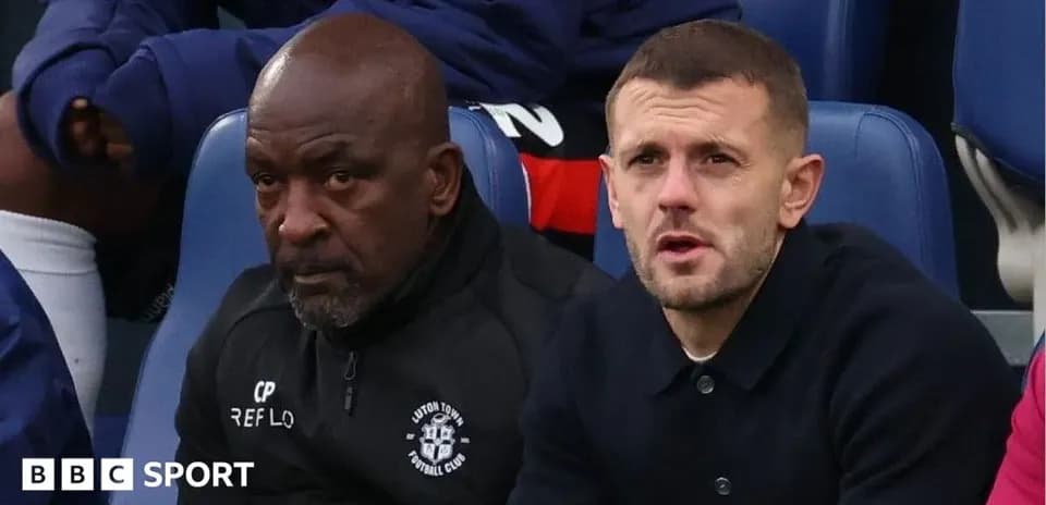 Coaches sitting on the bench during a match