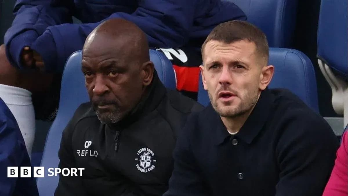 Coaches sitting on the bench during a match