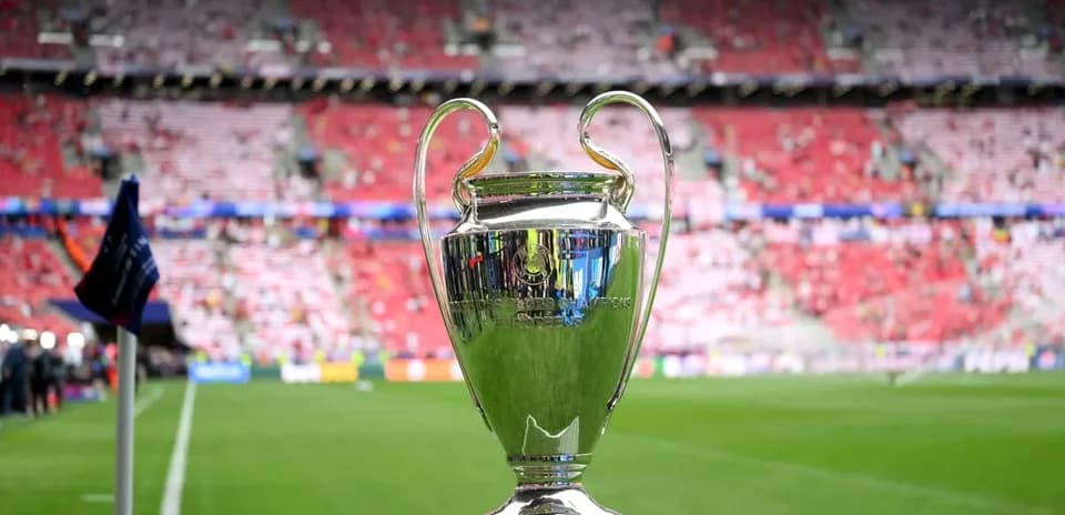 Champions League trophy on the pitch