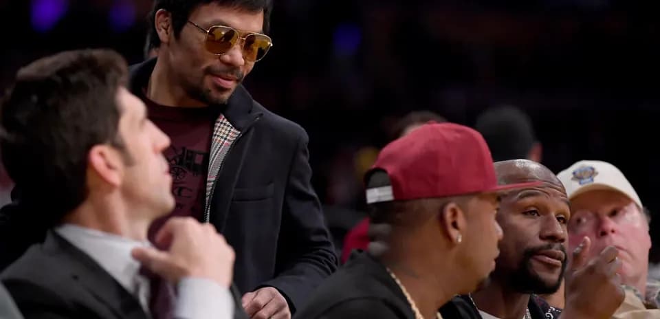 Manny Pacquiao conversing with friends at event