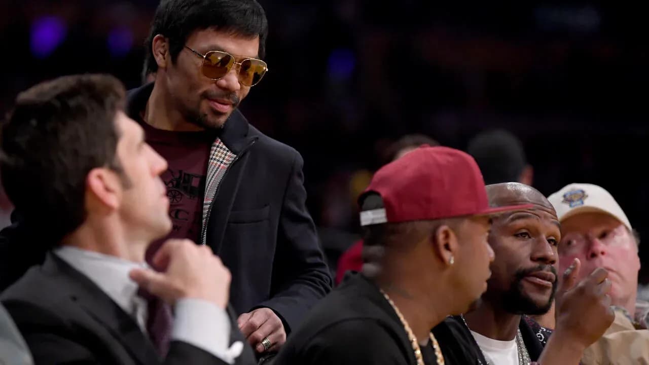 Manny Pacquiao conversing with friends at event