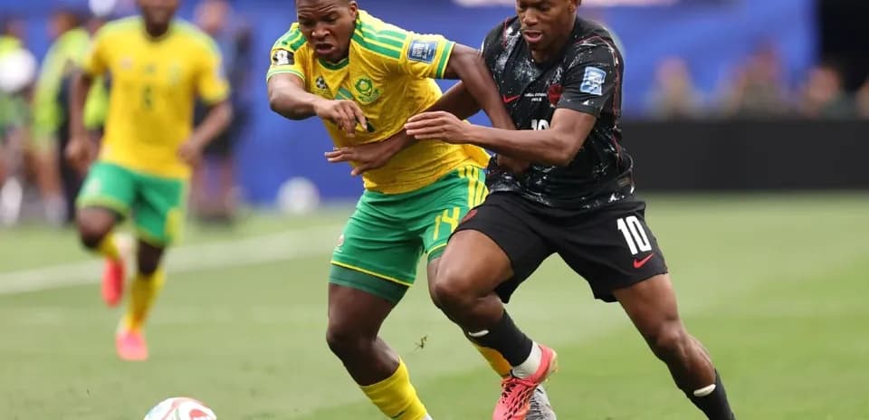 Two players battling for the ball during match