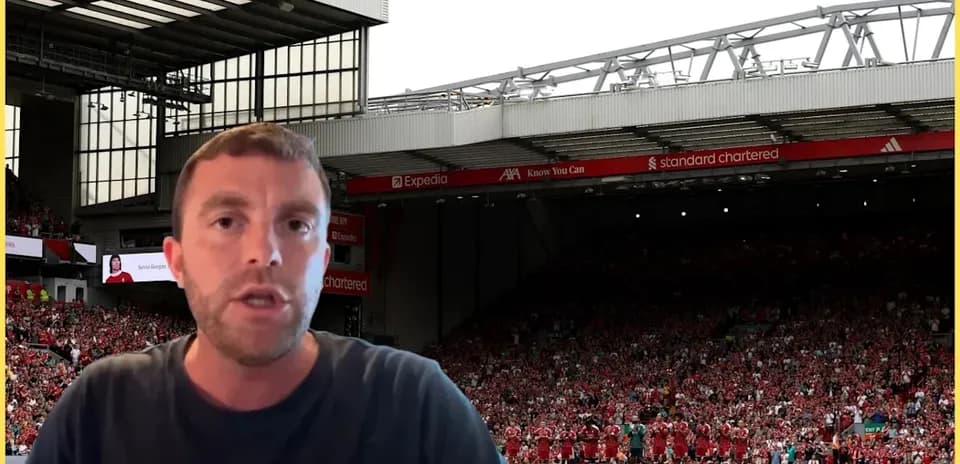 Analyst speaking in front of Liverpool stadium crowd