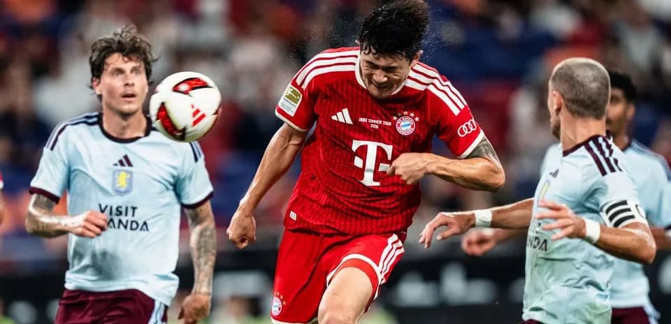 Bayern Munich player heading the ball in match