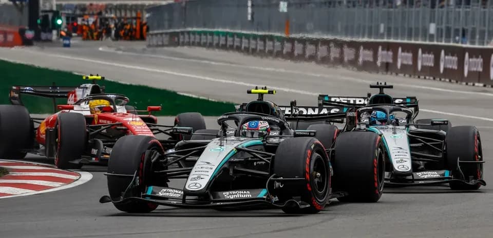 Formula 1 cars racing on track during competition
