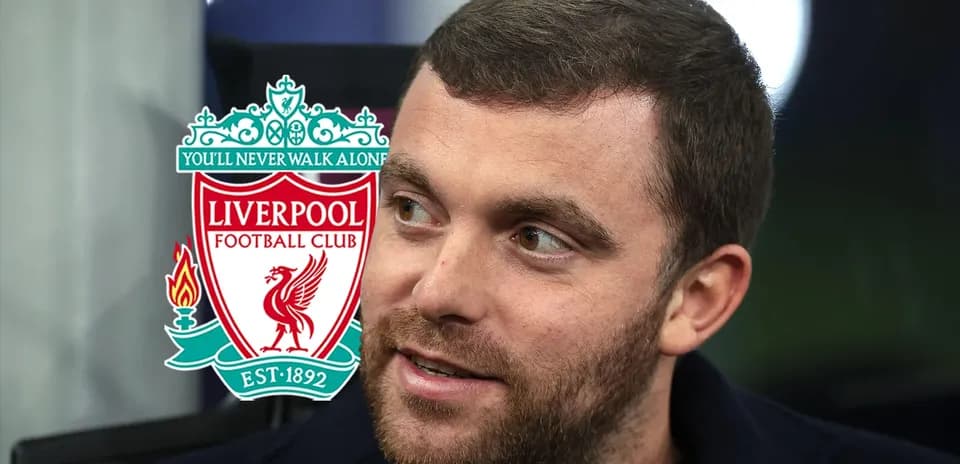 Shirted man with Liverpool FC logo in background