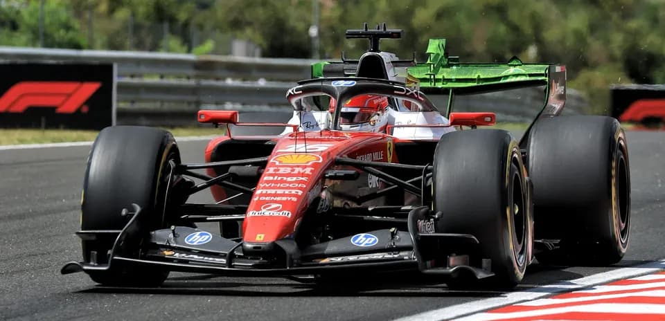Ferrari F1 car racing on track during competition