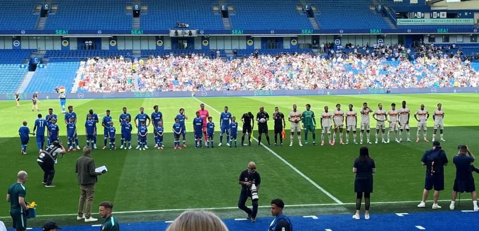 Football teams lined up before match at stadium