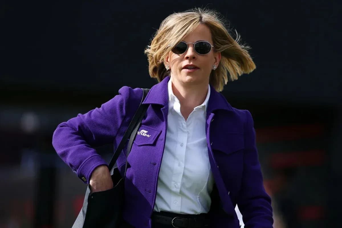 Woman in purple jacket walking with bag