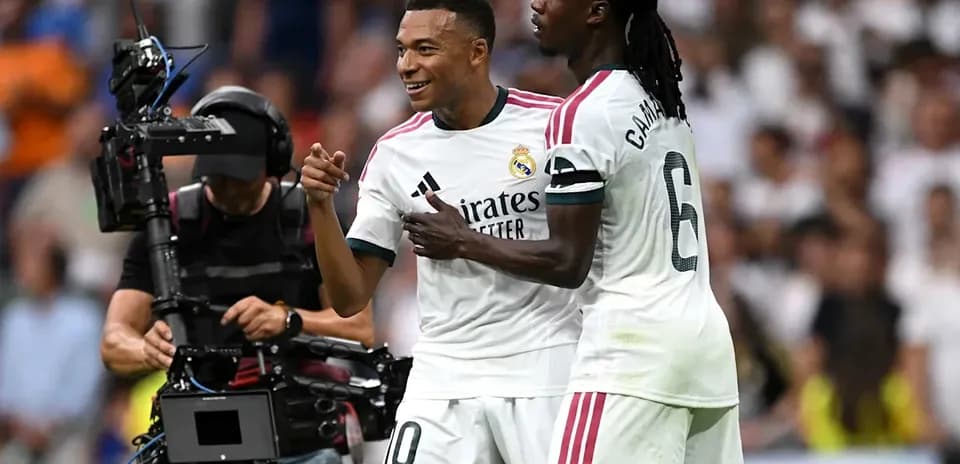 Mbappé celebrating with Camavinga during match