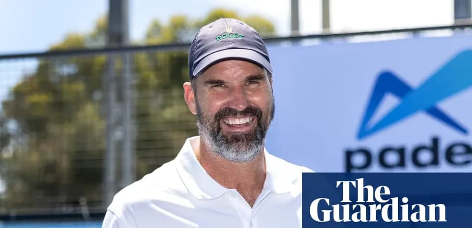 Smiling man in sports attire at padel event