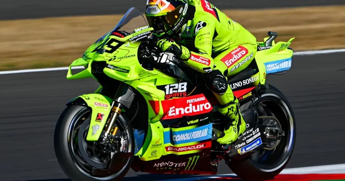 Motogp rider on a bright green motorcycle racing