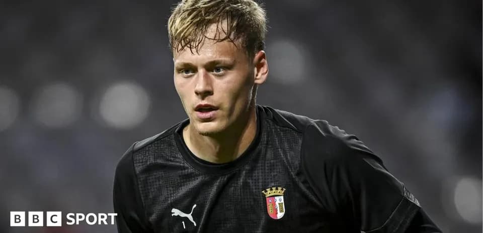Goalkeeper in black uniform during match preparation