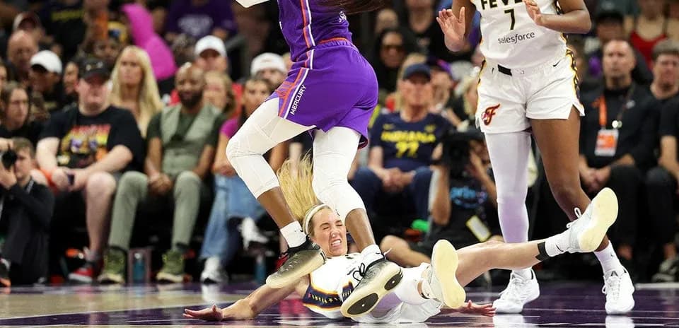 Player falling while competing for the ball during game