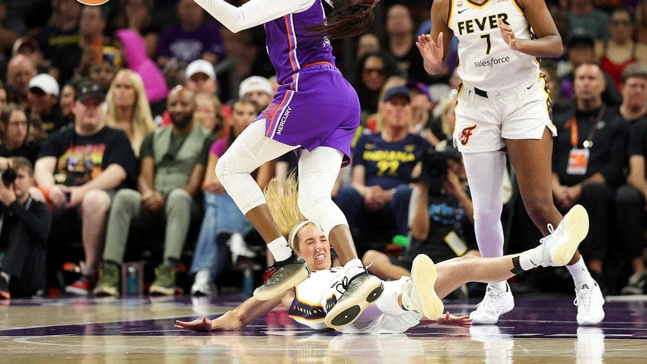 Player falling while competing for the ball during game