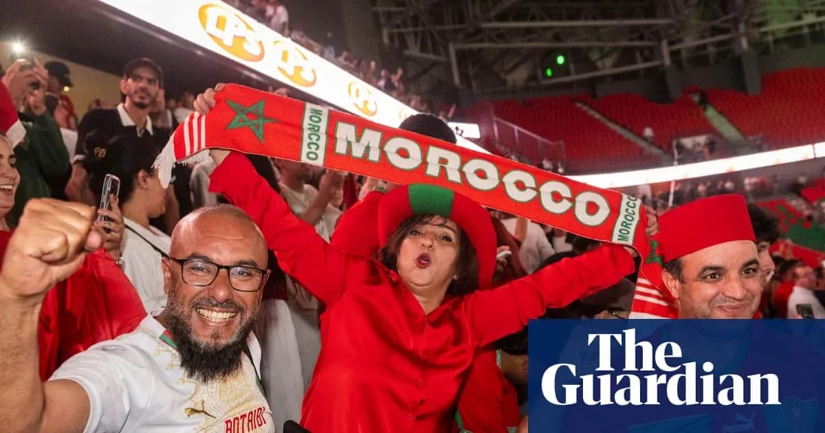Fans celebrating with Morocco scarves in stadium