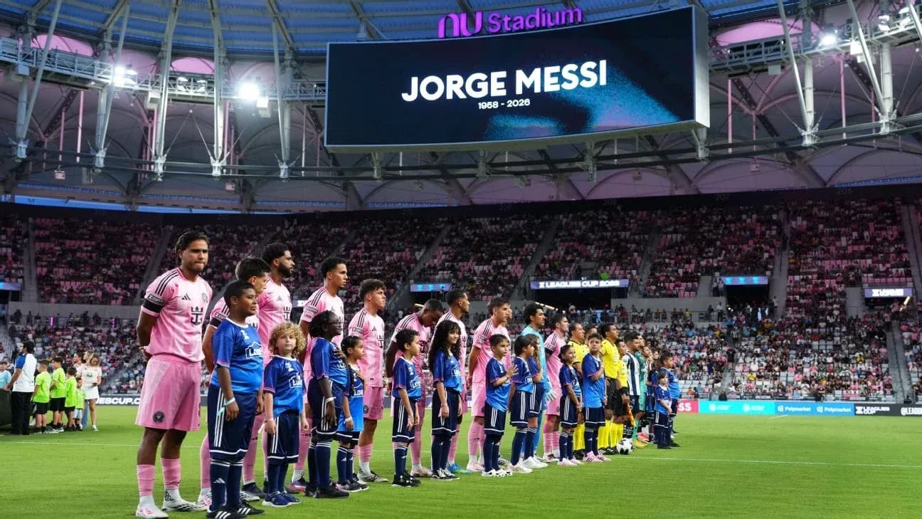 Players and children lining up before the match