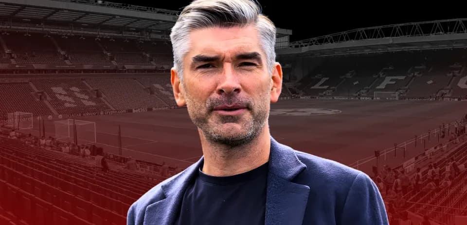Man in front of football stadium with empty seats