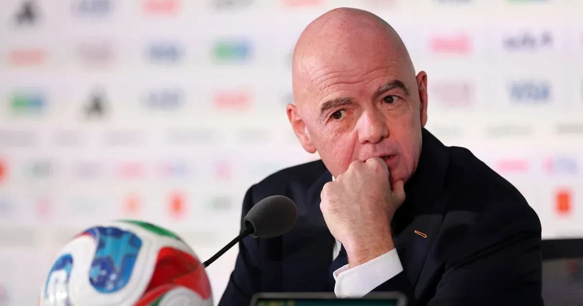 FIFA president at press conference with ball