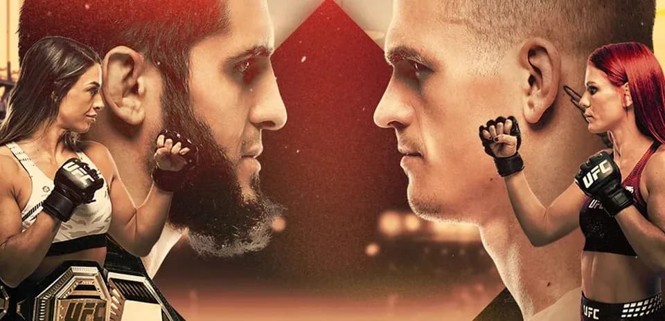 UFC fighters facing off with championship belt