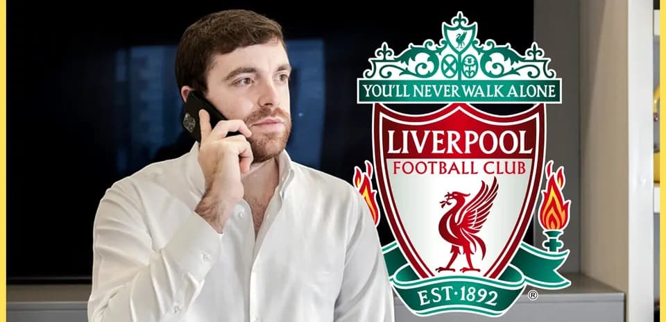 Man talking on phone with Liverpool FC logo background