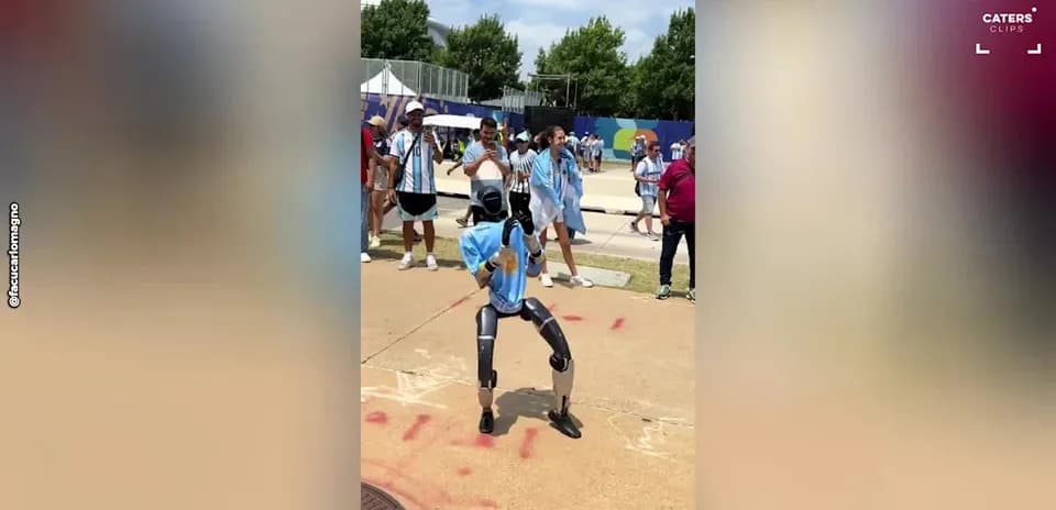 Robot dancing in front of cheering crowd