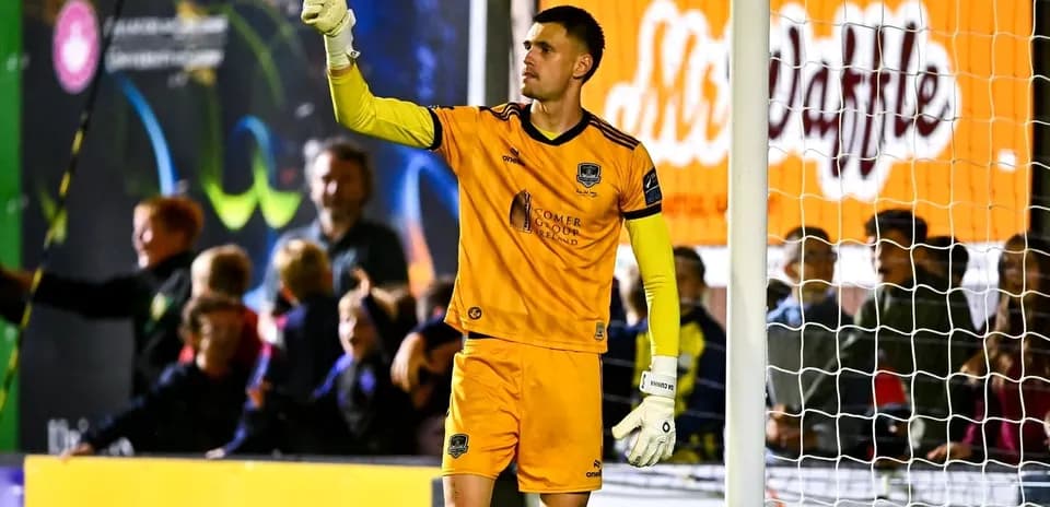 Goalkeeper signaling to fans during match