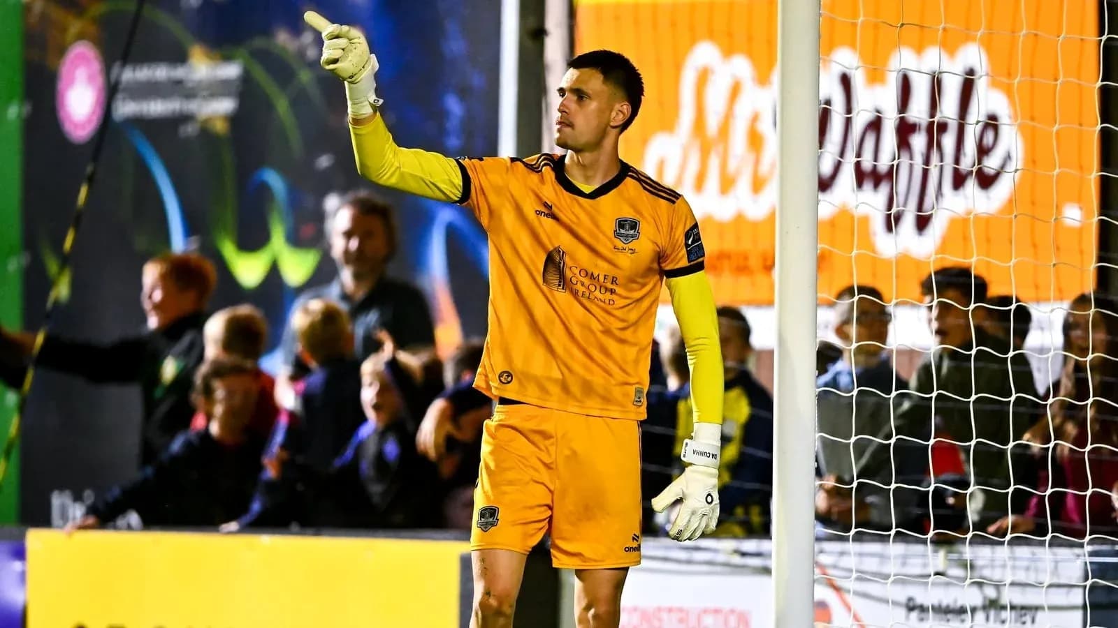 Goalkeeper signaling to fans during match