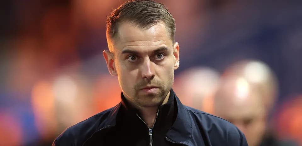 Coach walking on the sidelines during match