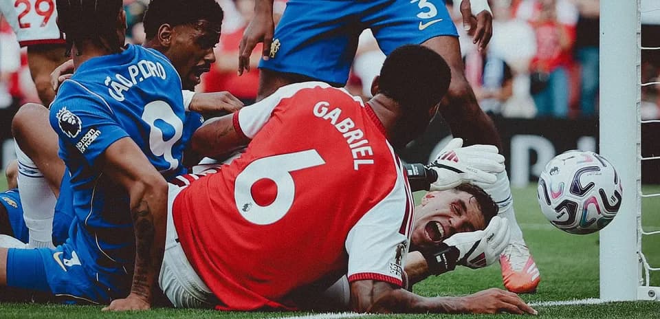 Players battling for the ball near the goal line