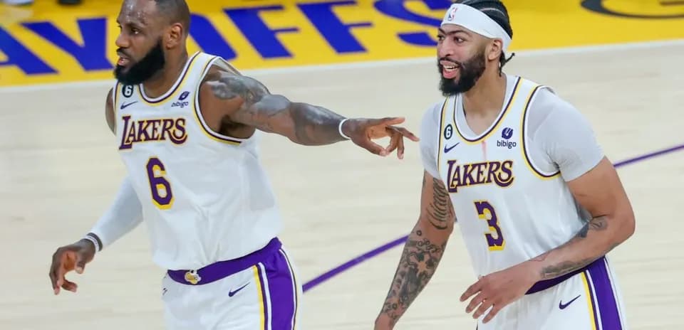 LeBron James and Anthony Davis celebrating during game