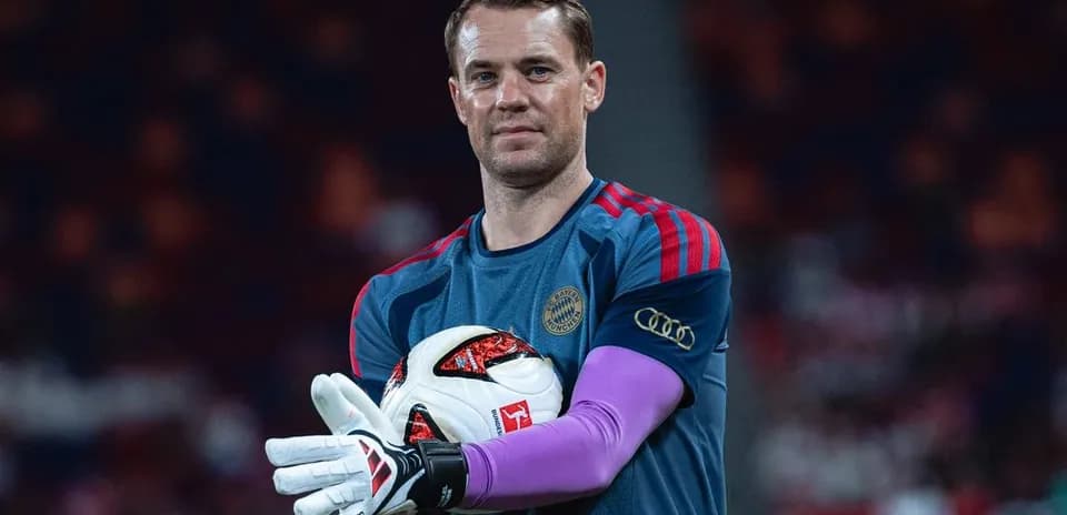 Goalkeeper holding ball during warm-up session