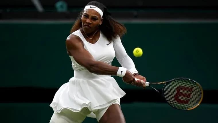 Tennis player hitting a ball during match
