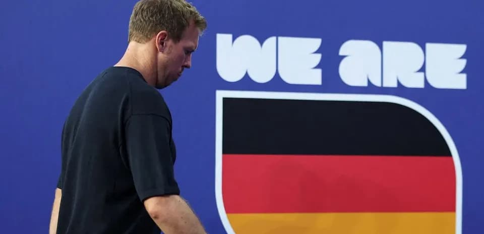Athlete walking past 'We Are Germany' sign