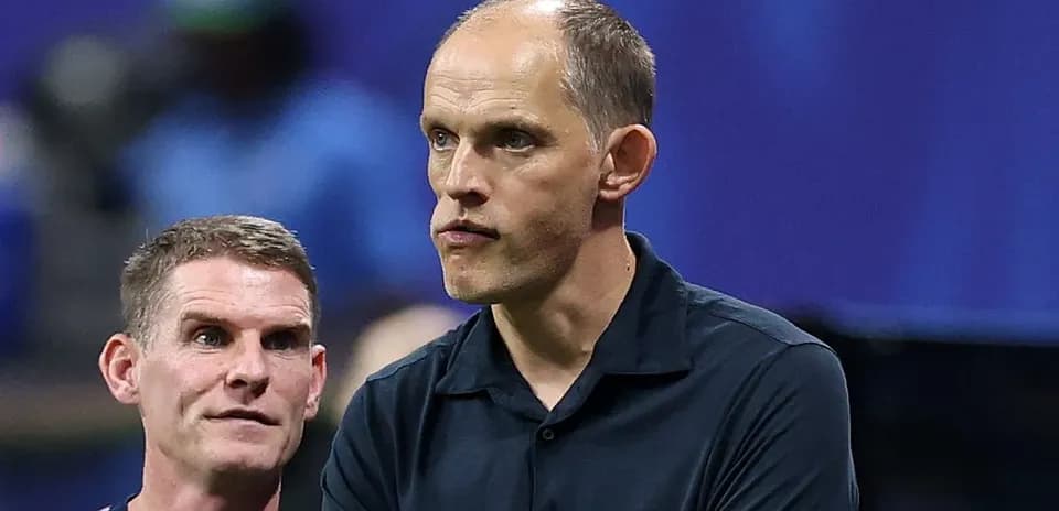 Two coaches discussing strategies during a match