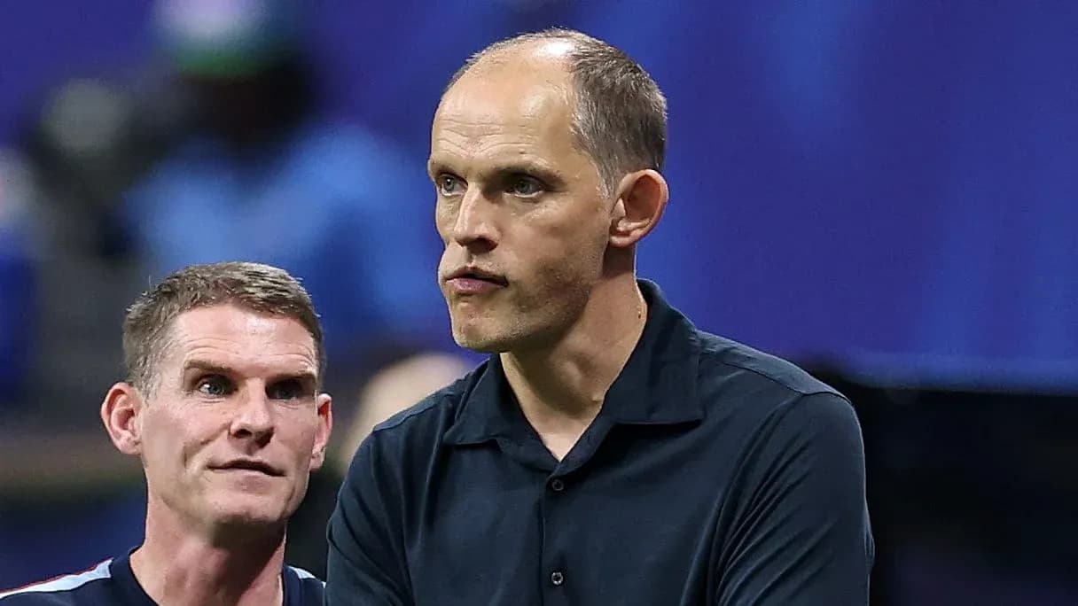 Two coaches discussing strategies during a match