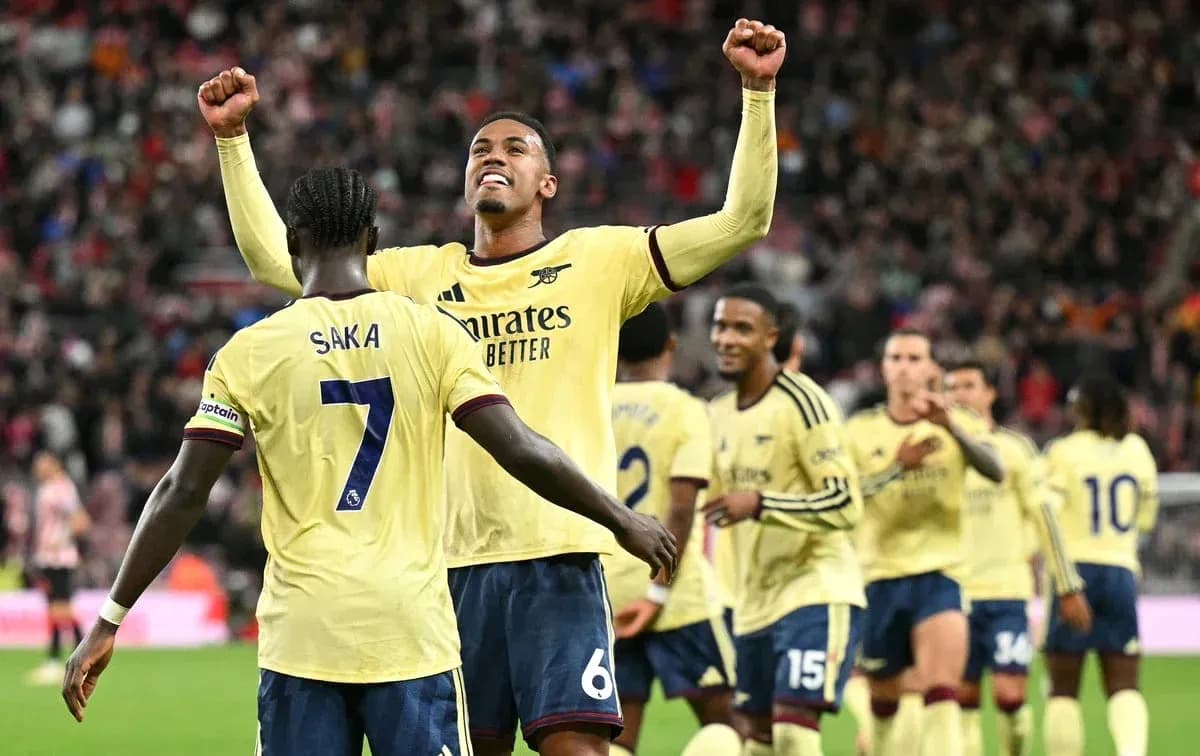 Arsenal players celebrating a goal on the pitch
