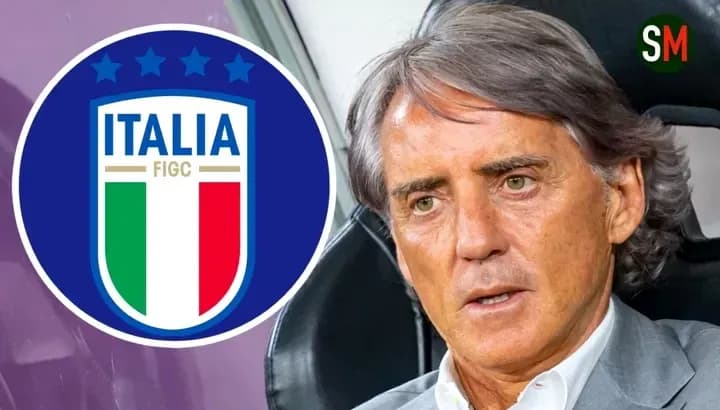 Mancini speaking with Italy logo in background