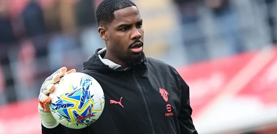 Porter holding a football before the match