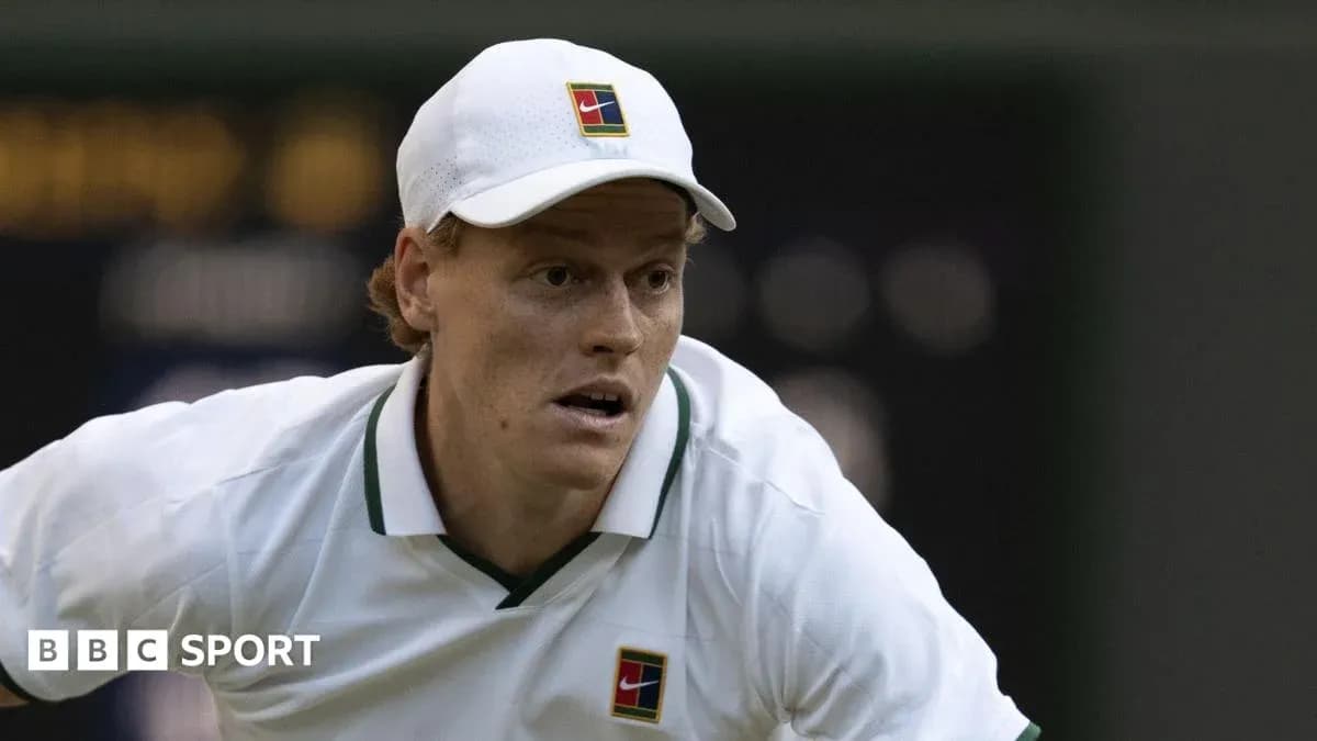 Tennis player preparing to serve on court