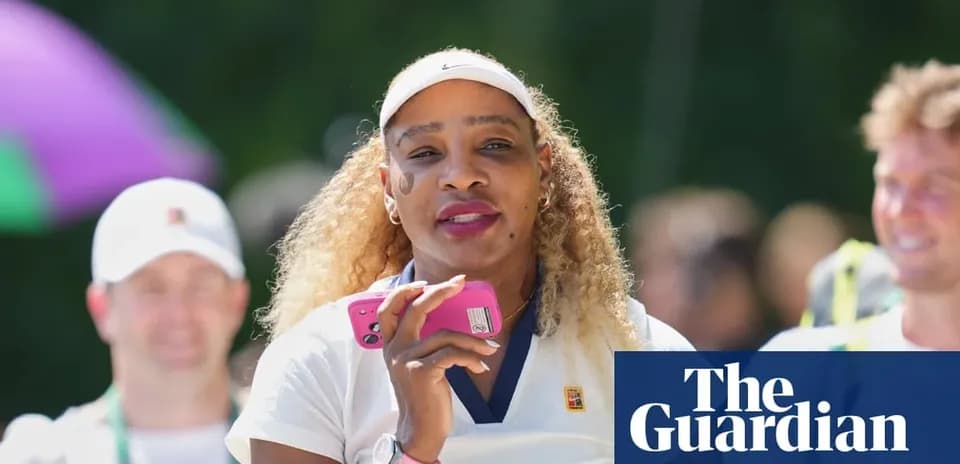 Tennis player holding a phone, smiling outdoors