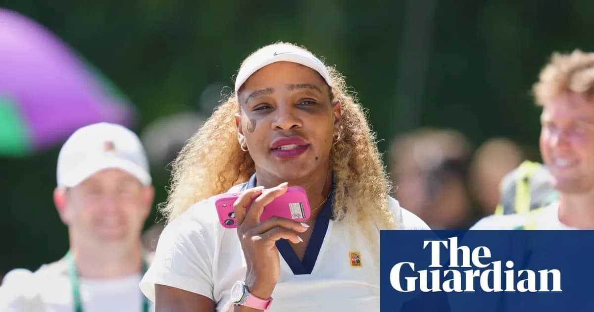 Tennis player holding a phone, smiling outdoors