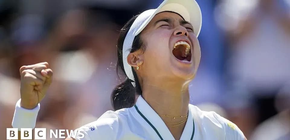Tennis player celebrating victory with raised fist