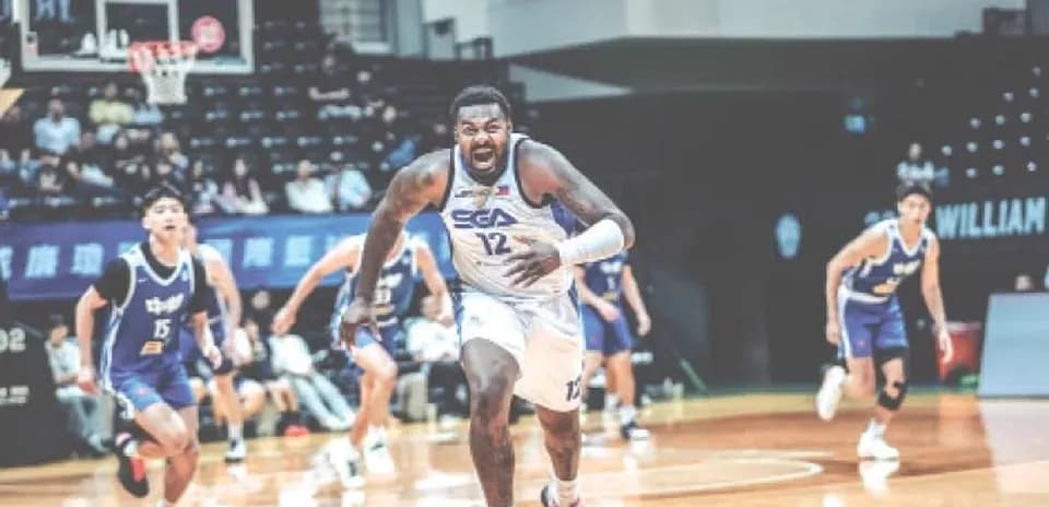 Player 12 sprinting after loose basketball during game