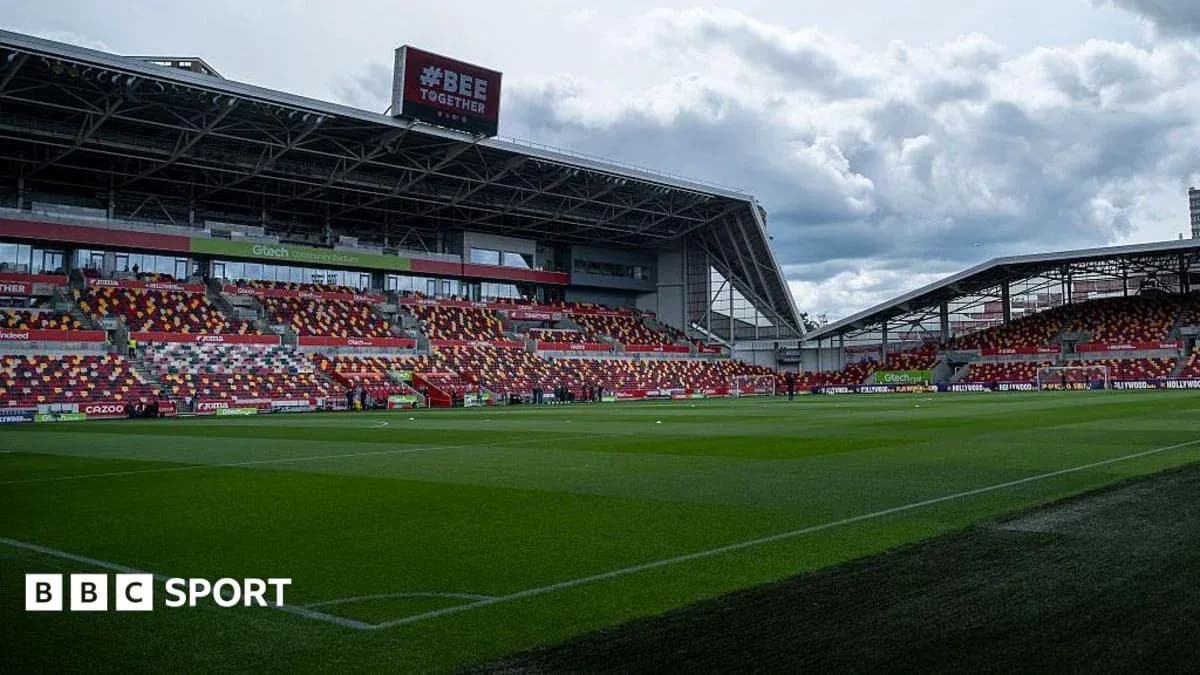 Brentford Community Stadium with empty stands and green pitch